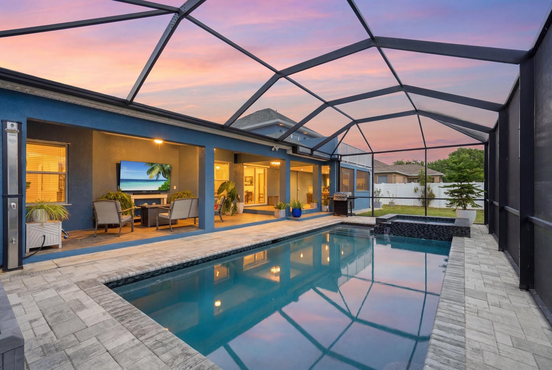 Lit lanai, pool and spa at sunset, 1405 SW 1st Pl, Cape Coral